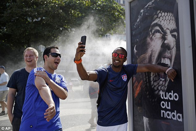 Cannibal: Football-lovers in the city imitated Italian defender Giorgio Chiellini with his injured shoulder.