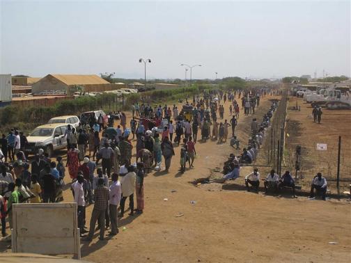 Civilians arrive to a shelter at the United Nations Mission in the Republic of South Sudan compound on the outskirts of the capital Juba