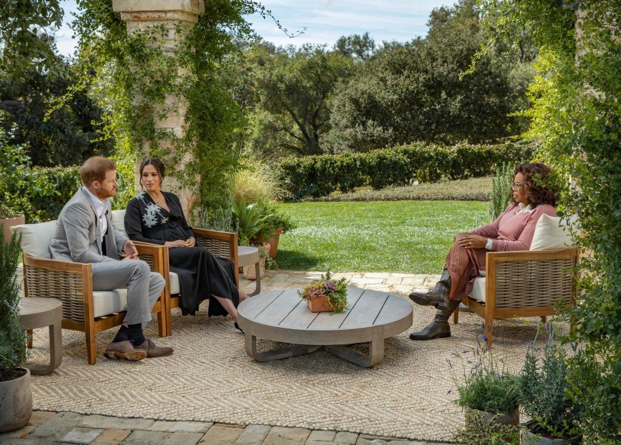 This undated image released March 7, 2021 courtesy of Harpo Productions shows Britain’s Prince Harry (L) and his wife Meghan (C), Duchess of Sussex, in a conversation with US television host Oprah Winfrey. AFP/ HARPO PRODUCTIONS